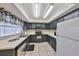 Functional kitchen with black cabinets, white countertops, and tile flooring at 2812 Ormandy Ct, Tampa, FL 33618