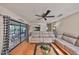 Bright living room features a comfortable seating arrangement and view of kitchen and patio at 2812 Ormandy Ct, Tampa, FL 33618