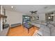 Spacious living room with a cozy fireplace, built-in shelves, and a view of the patio at 2812 Ormandy Ct, Tampa, FL 33618