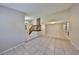 Open-concept living area with tile floors, staircase, and seamless flow to dining and living spaces, ideal for modern living at 2812 Ormandy Ct, Tampa, FL 33618