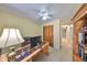 Office space featuring a desk, office chair, and built in shelving in a yellow room at 2812 Ormandy Ct, Tampa, FL 33618