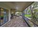 Enjoy this screened in patio that overlooks the yard and has enough space for outdoor seating at 2812 Ormandy Ct, Tampa, FL 33618