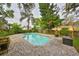Refreshing backyard pool area surrounded by lush landscaping providing a private outdoor oasis at 2812 Ormandy Ct, Tampa, FL 33618