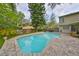 Backyard pool with a brick paver patio and fenced yard at 2812 Ormandy Ct, Tampa, FL 33618
