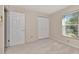 Neutral bedroom with window, closet, and carpet at 3051 Egret Ter, Safety Harbor, FL 34695