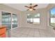 Bright breakfast nook with a sliding glass door offering views of the screened-in pool area at 3051 Egret Ter, Safety Harbor, FL 34695
