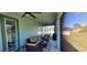 Cozy screened-in lanai with stylish furnishings, ceiling fans, and outdoor living space at 3190 Darius Ave, North Port, FL 34288