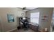 Well-lit home office with large desk, comfortable chair, and modern decor at 3190 Darius Ave, North Port, FL 34288