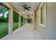 Long, covered patio area with recessed lighting and ceiling fans, providing a seamless transition to the outdoors at 35150 Roth Ln, Dade City, FL 33525