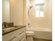 White bathroom featuring a shower/tub combo and a grey countertop at 35150 Roth Ln, Dade City, FL 33525