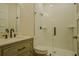 Modern bathroom featuring a glass enclosed shower, decorative vanity, and stylish fixtures at 35150 Roth Ln, Dade City, FL 33525