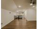 Expansive bonus room with wood flooring, vaulted ceilings, and recessed lighting at 35150 Roth Ln, Dade City, FL 33525