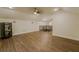 Large bonus room with hardwood floors, recessed lighting, and stairs with iron railing at 35150 Roth Ln, Dade City, FL 33525