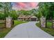 Charming single-story home with stone accents, a two-car garage, and a long winding driveway at 35150 Roth Ln, Dade City, FL 33525