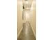 Hallway view leading to a bathroom with modern fixtures and clean design at 35150 Roth Ln, Dade City, FL 33525
