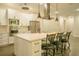 Cozy kitchen features a center island, stainless steel appliances, and barstool seating at 35150 Roth Ln, Dade City, FL 33525