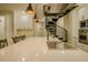 Modern kitchen featuring a spiral staircase, stainless steel appliances, and a large center island at 35150 Roth Ln, Dade City, FL 33525