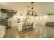 Open kitchen boasts stainless steel appliances and island seating near a spiral staircase at 35150 Roth Ln, Dade City, FL 33525