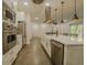 Modern kitchen boasts stainless steel appliances, a center island, and ample counter space at 35150 Roth Ln, Dade City, FL 33525