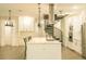 Bright, spacious kitchen features a large island, stainless steel appliances, and a unique spiral staircase at 35150 Roth Ln, Dade City, FL 33525