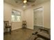 Inviting sitting area includes comfortable seating and large window, offering a cozy space to relax and enjoy the view at 35150 Roth Ln, Dade City, FL 33525