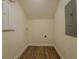 Small utility room with wood-look floors and electrical outlets at 35150 Roth Ln, Dade City, FL 33525