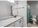 Bathroom featuring a single sink, large mirror, white cabinets, and a shower with a curtain at 3621 Country Pointe Pl, Palm Harbor, FL 34684
