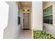 Inviting entryway with neutral colors, well-lit and featuring a decorative front door at 3621 Country Pointe Pl, Palm Harbor, FL 34684