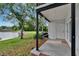 Backyard patio area with pond views and access to the home's exterior door at 3821 N Oak Dr # J31, Tampa, FL 33611