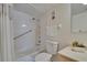 Clean bathroom featuring tiled shower and bath combo with safety bar and single sink vanity at 3821 N Oak Dr # J31, Tampa, FL 33611
