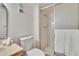 Bathroom featuring a glass-enclosed shower and white vanity at 3821 N Oak Dr # J31, Tampa, FL 33611