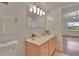 Bright bathroom featuring a well-lit mirror and a clean, classic vanity at 3821 N Oak Dr # J31, Tampa, FL 33611