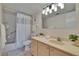 Well-lit bathroom featuring a shower-tub combination and a single sink vanity at 3821 N Oak Dr # J31, Tampa, FL 33611