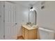 Bathroom featuring a cream vanity and well-lit mirror at 3821 N Oak Dr # J31, Tampa, FL 33611