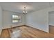 Bedroom with hardwood floors and a window letting in natural light at 3821 N Oak Dr # J31, Tampa, FL 33611