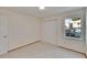 Bedroom featuring window and closet, offering a bright and organized space at 3821 N Oak Dr # J31, Tampa, FL 33611
