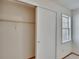 Bright, carpeted closet with sliding doors and shelving for optimal storage at 3821 N Oak Dr # J31, Tampa, FL 33611