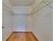 Walk-in closet with hardwood floors and wire shelving at 3821 N Oak Dr # J31, Tampa, FL 33611