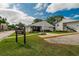 Exterior view of the clubhouse, featuring manicured lawn and 'Clubhouse Office' signage at 3821 N Oak Dr # J31, Tampa, FL 33611
