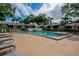 Swim in the community pool with sundeck and lounge chairs at 3821 N Oak Dr # J31, Tampa, FL 33611