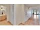 Hallway view showcasing a bathroom and access to the main living area at 3821 N Oak Dr # J31, Tampa, FL 33611