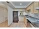 Efficient kitchen design features stainless appliances, ample countertop space, and convenient access to other rooms at 3821 N Oak Dr # J31, Tampa, FL 33611