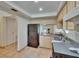 Efficient kitchen with stainless steel appliances, ample counter space, and tile flooring at 3821 N Oak Dr # J31, Tampa, FL 33611