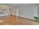 Inviting living room boasts hardwood floors, with easy access to hallway and partial kitchen view at 3821 N Oak Dr # J31, Tampa, FL 33611