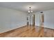 Living room with hardwood floors featuring access to other rooms at 3821 N Oak Dr # J31, Tampa, FL 33611