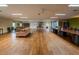 Spacious meeting room with ample seating, hardwood floors, and abundant natural light at 3821 N Oak Dr # J31, Tampa, FL 33611