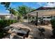 Community pool area featuring a gazebo and outdoor grills at 3821 N Oak Dr # J31, Tampa, FL 33611