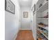 Hallway features tile flooring, white walls and a built-in shoe rack at 4214 W Beach Park Dr, Tampa, FL 33609