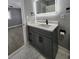 Bathroom with updated vanity, quartz countertop, modern fixtures, and tiled floors at 4619 Helena Ne St, St Petersburg, FL 33703