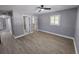 Spacious bedroom with neutral walls, laminate flooring, and a ceiling fan at 4619 Helena Ne St, St Petersburg, FL 33703